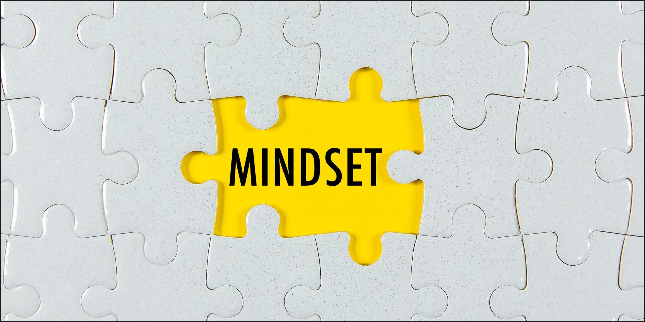 Puzzle beim dem zwei Teile fehlen mit dem Wort "Mindset"